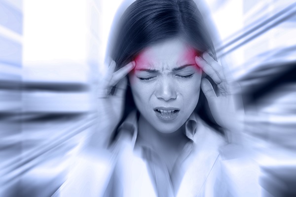 Woman experiencing a migraine headache