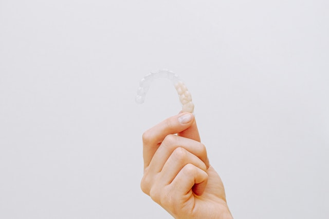 holding an Invisalign